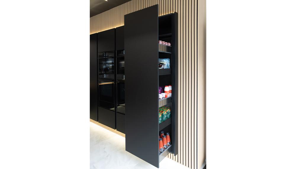 Masterclass Kitchens’ super-sleek H-Line Amalfi Onyx with Legrabox MagnaSpace Pull-Out Larder unit shown here in a project by Kingswell Kitchens, Chichester, is an ideal storage solution for those after clean lines and a professional look